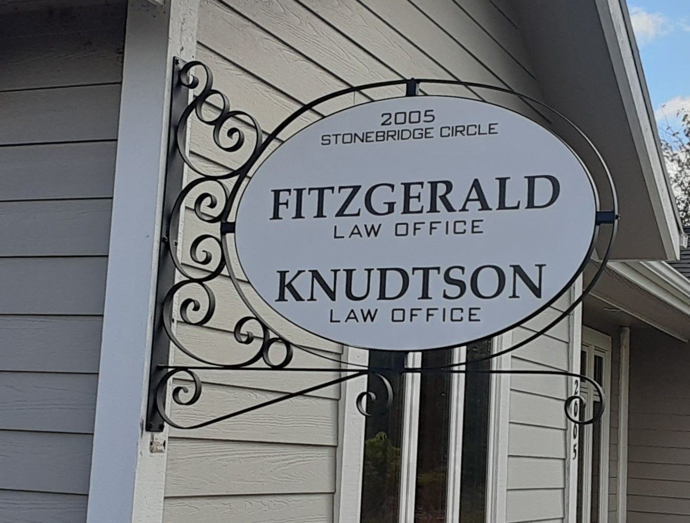 A sign for fitzgerald and knudtson law office