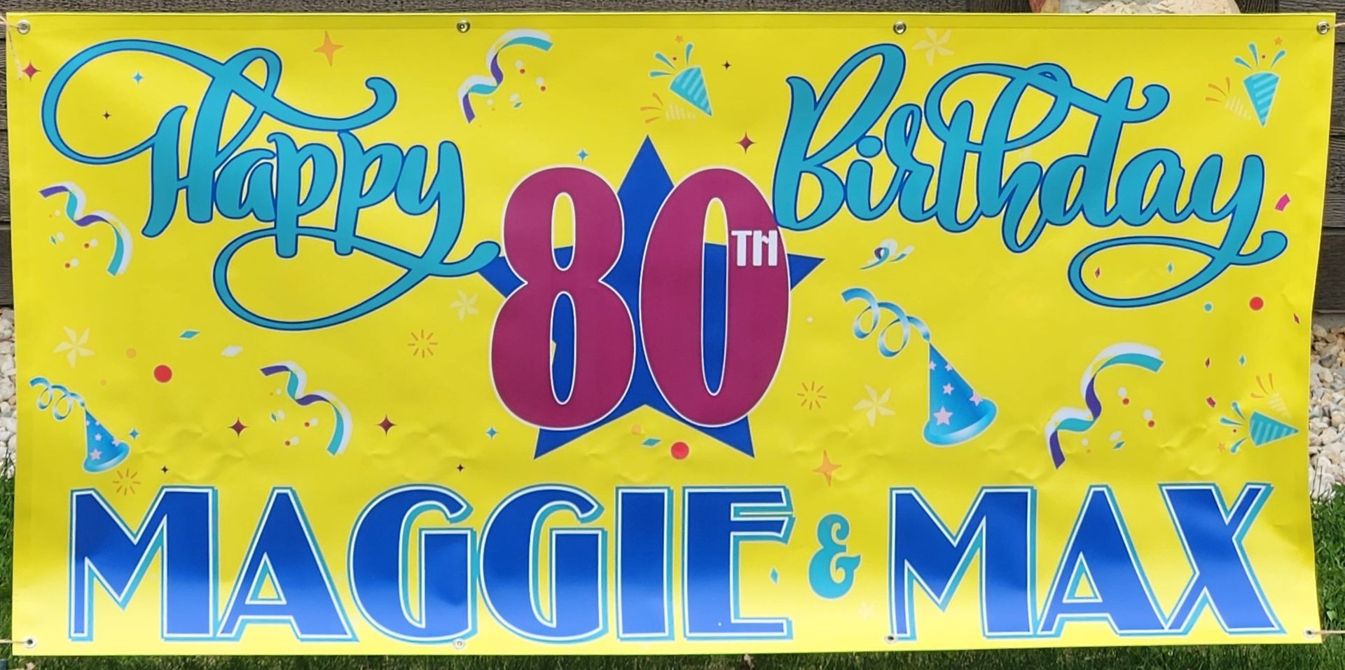 A happy 80th birthday sign for maggie and max