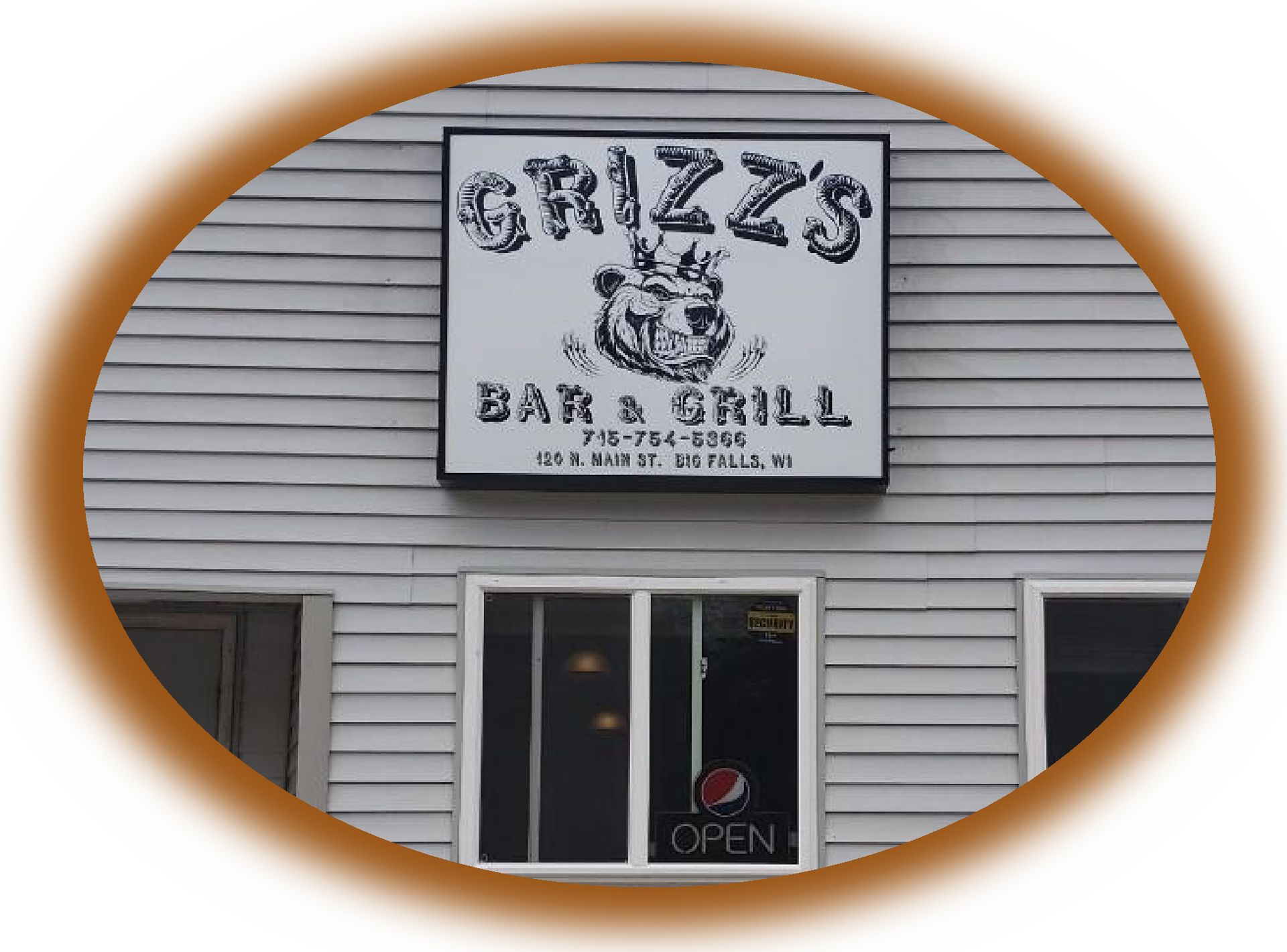 Sign for Grizz's Bar & Grill above a window, showing a bear logo and an open sign.