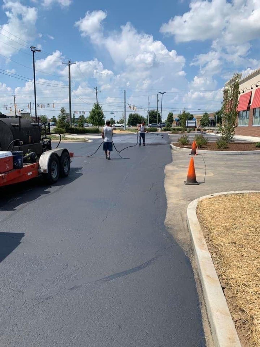 A group of people are working on a road.
