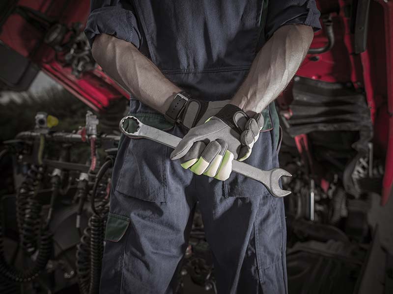 man holding a wrench
