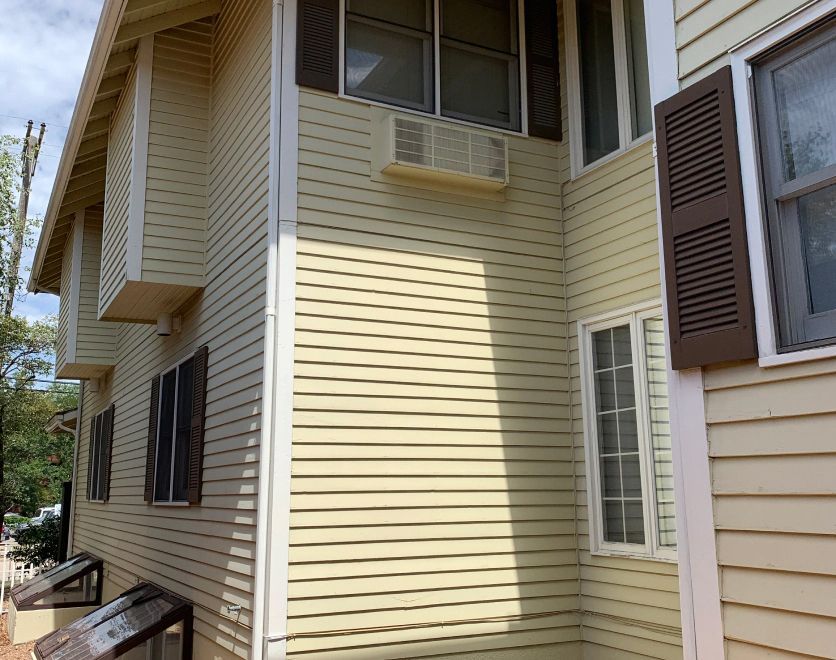 A house with a lot of windows and siding