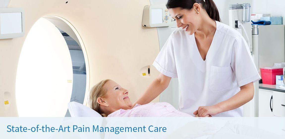A healthcare worker assists a patient in a medical scanner