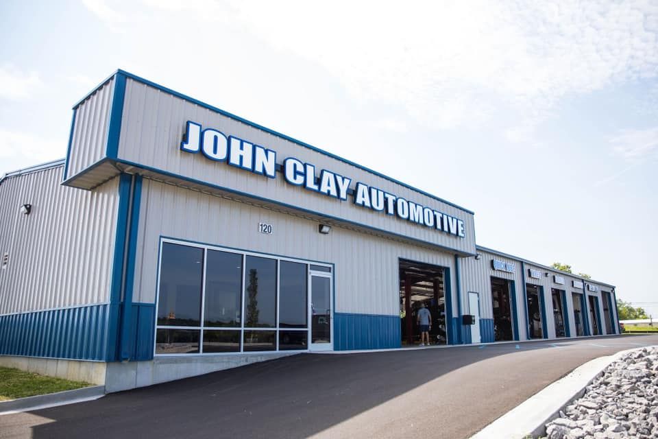 John clay automotive is a large building with a lot of windows.