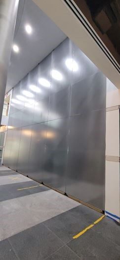 A large wall with a blurry reflection