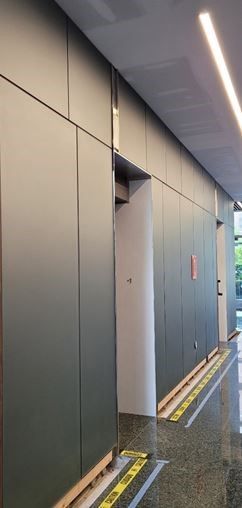 A hallway with a lot of walls and a yellow line on the floor