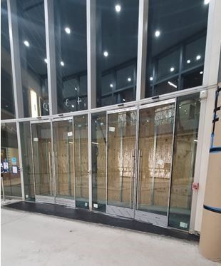 A building with a lot of glass doors and windows