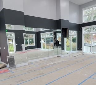 A large room with a lot of glass windows and doors