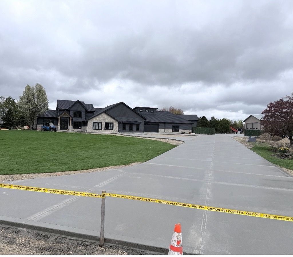 Caution tape across a driveway in a suburban neighborhood under cloudy skies.