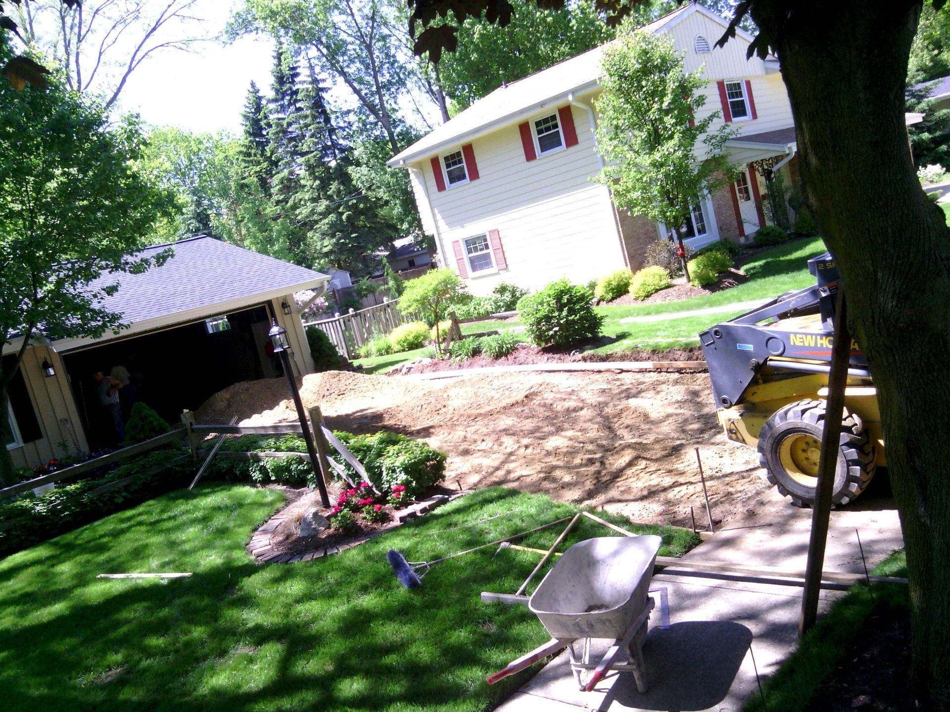 A wheelbarrow is sitting in front of a house