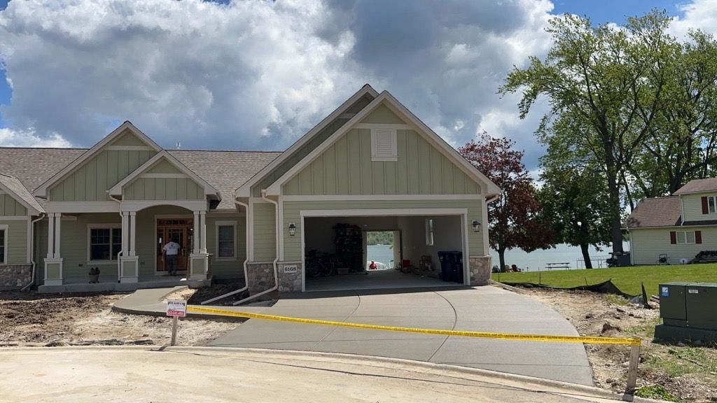 A large house with a large garage is being built.