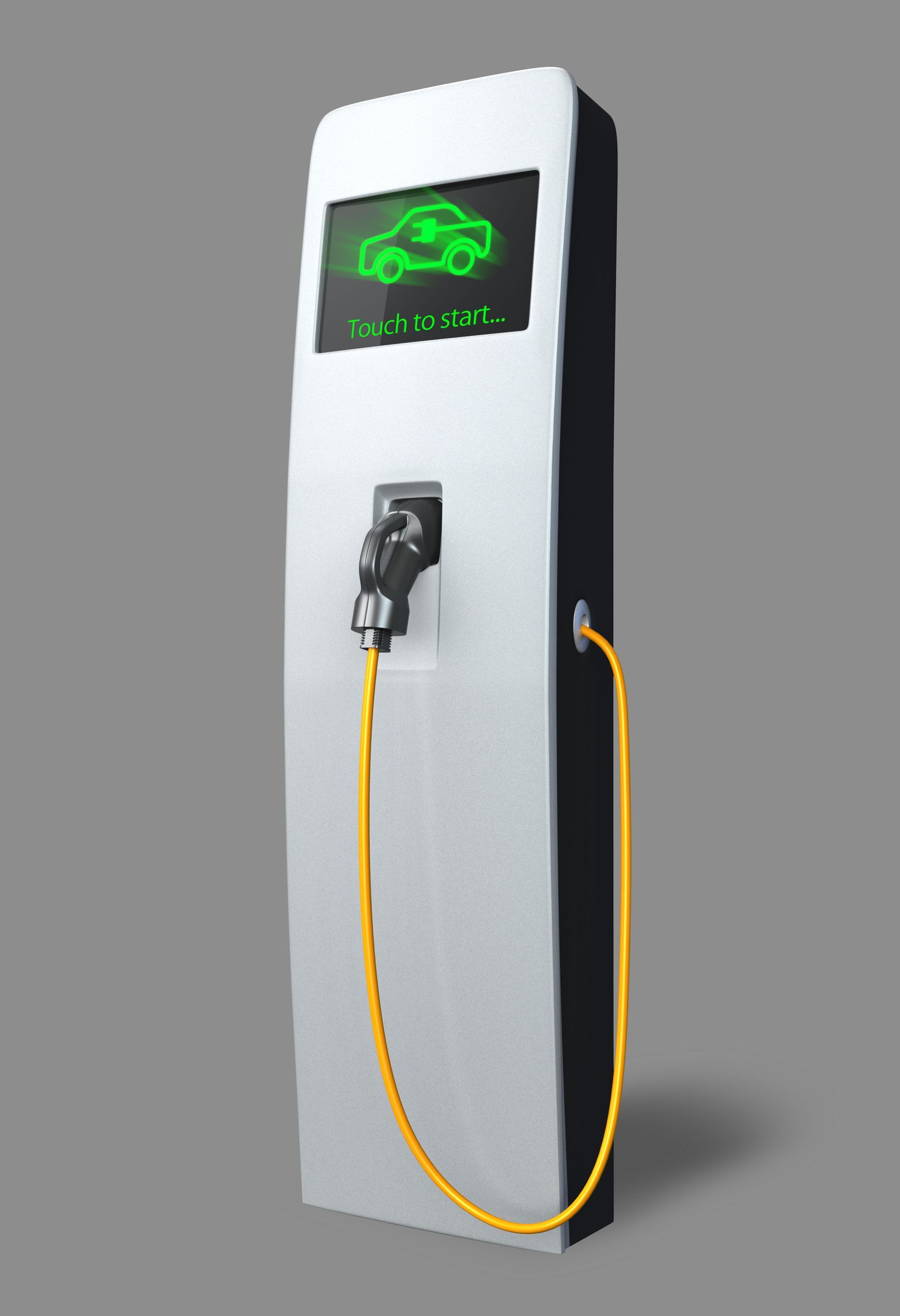 White electric vehicle charging station with a plugged-in cable and green display icon