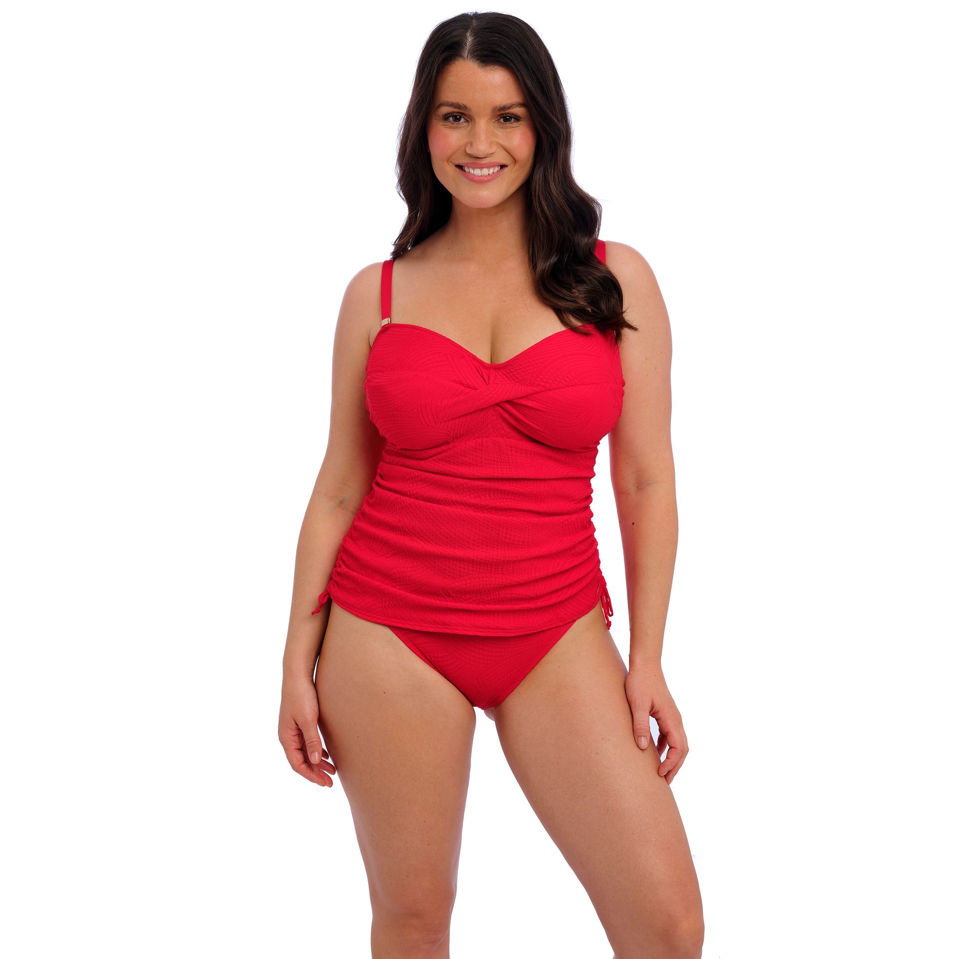 A woman is wearing a red swimsuit