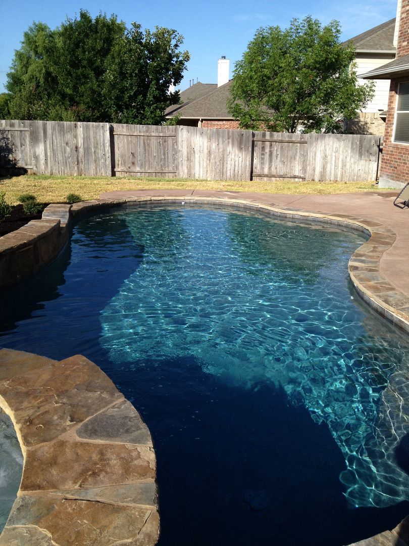 There is a waterfall in the middle of the pool.