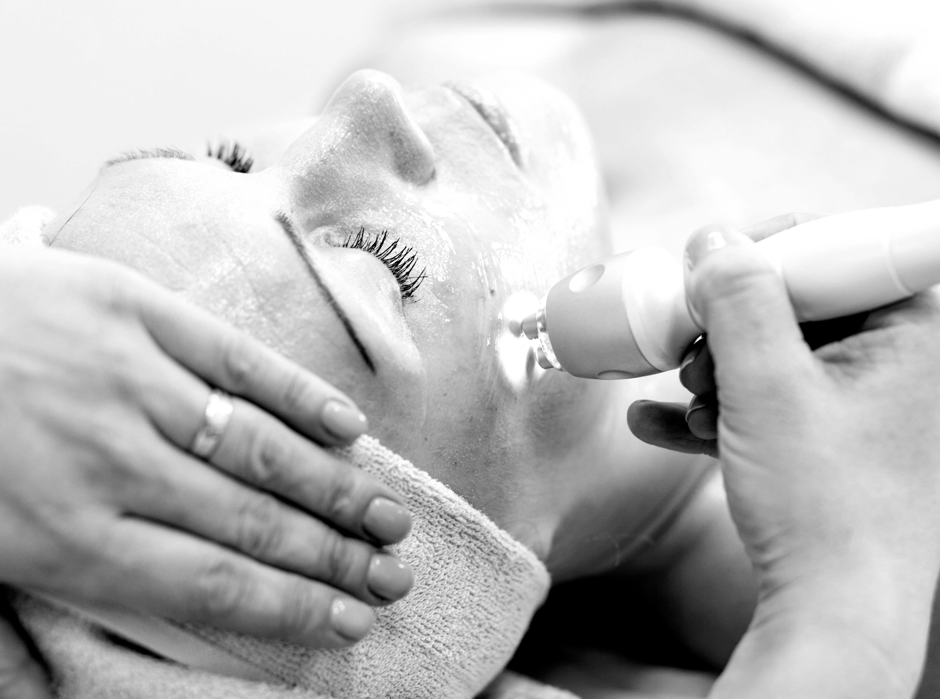 A person is using micro needling to treat their skin.