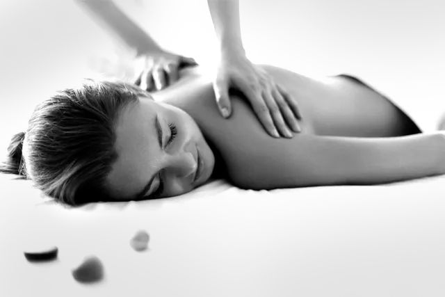 A woman having a back massage.