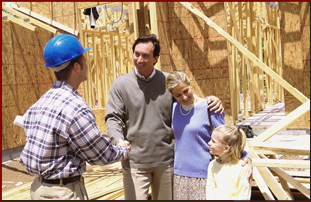 Man with his family handshakes the contractor building his house