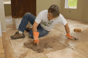 Handyman fixing floor