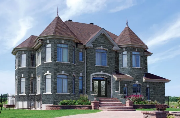 A large brick house with a red roof