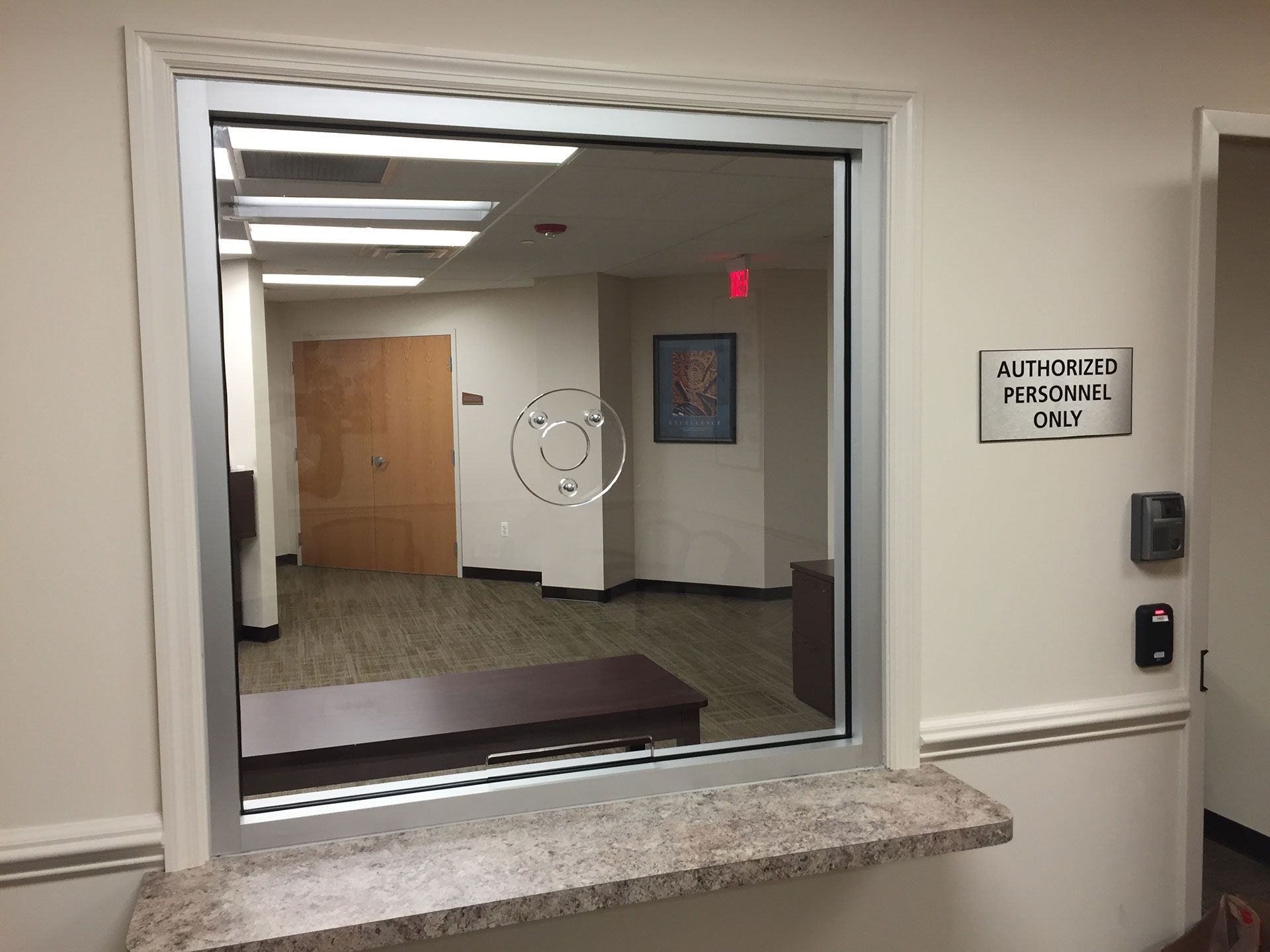 A window in a room with a sign on the wall