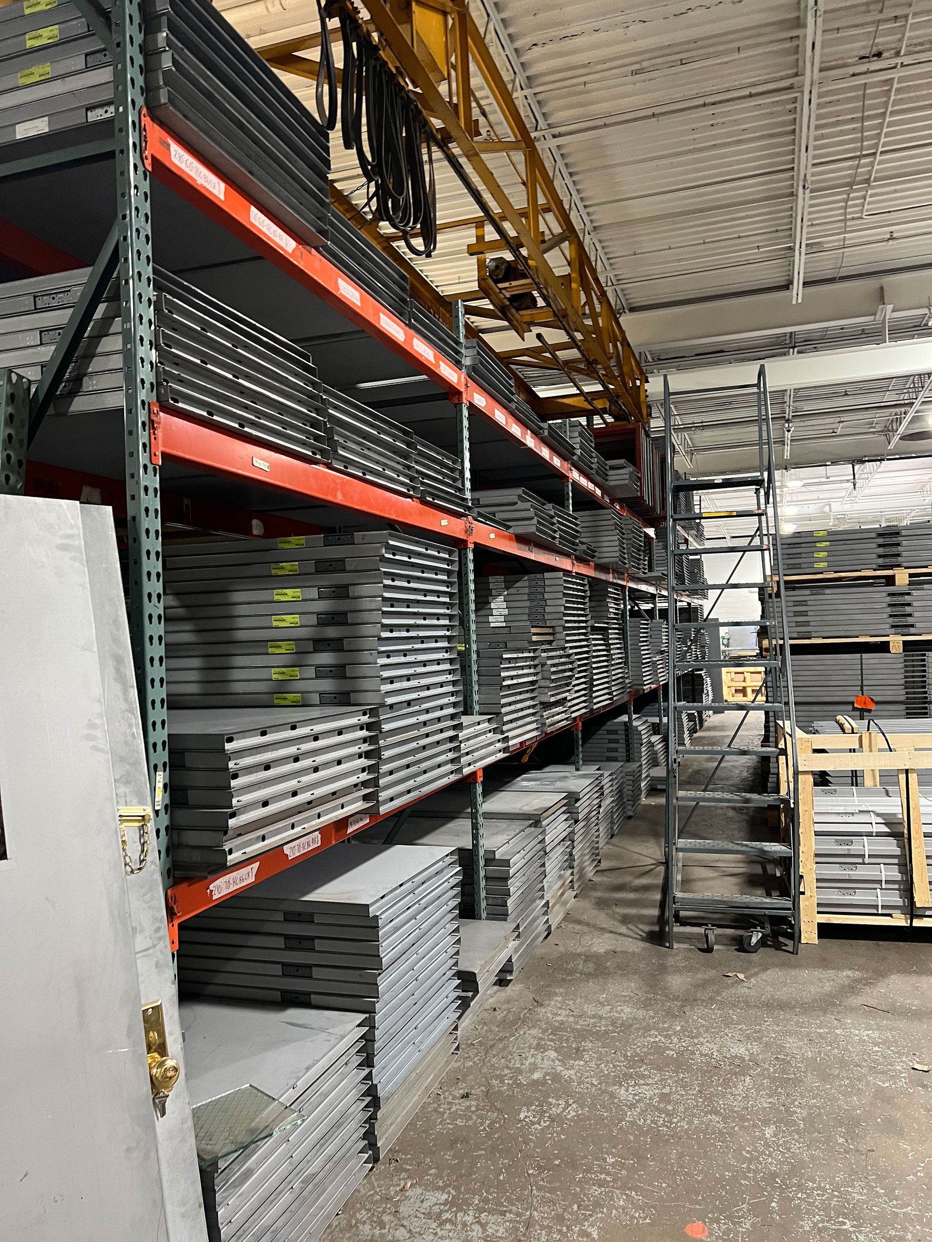 A warehouse filled with lots of shelves and pallets