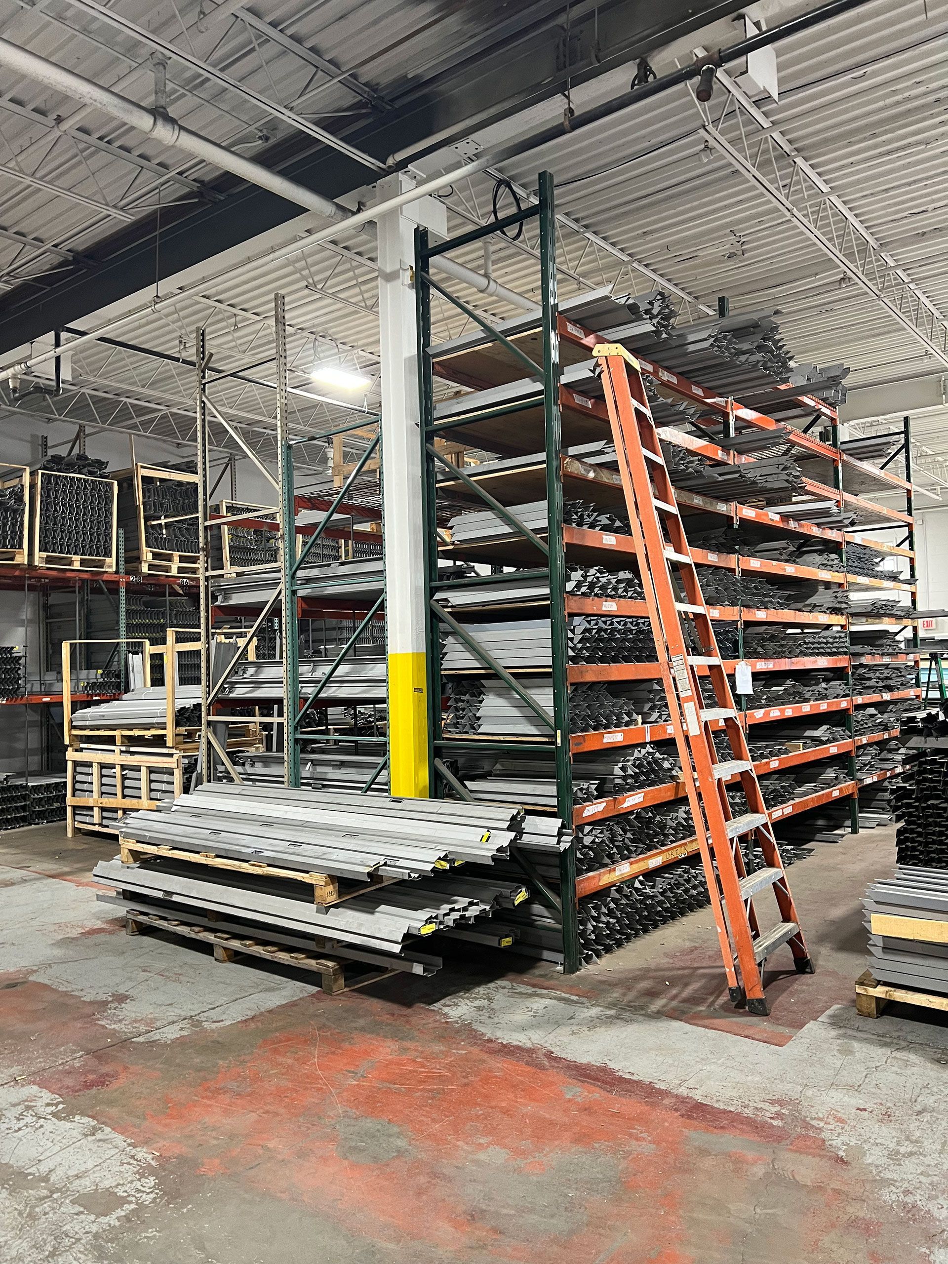 A warehouse filled with lots of shelves and a ladder