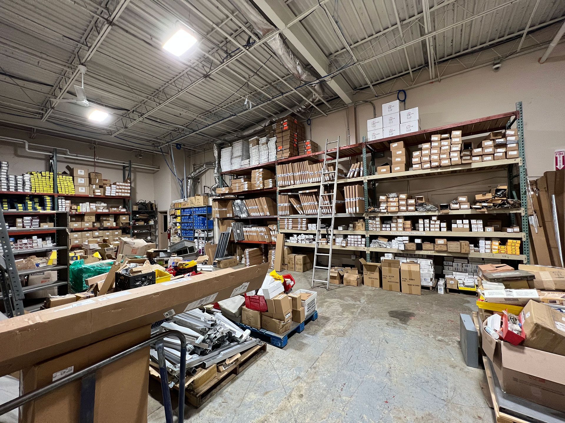 A large warehouse filled with lots of boxes and shelves