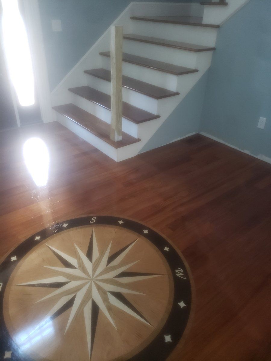 A wooden floor with a compass on it