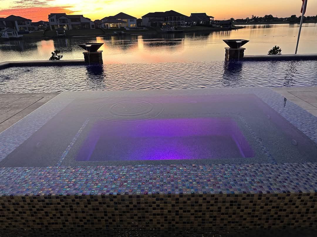 There is a purple light in the middle of the pool.