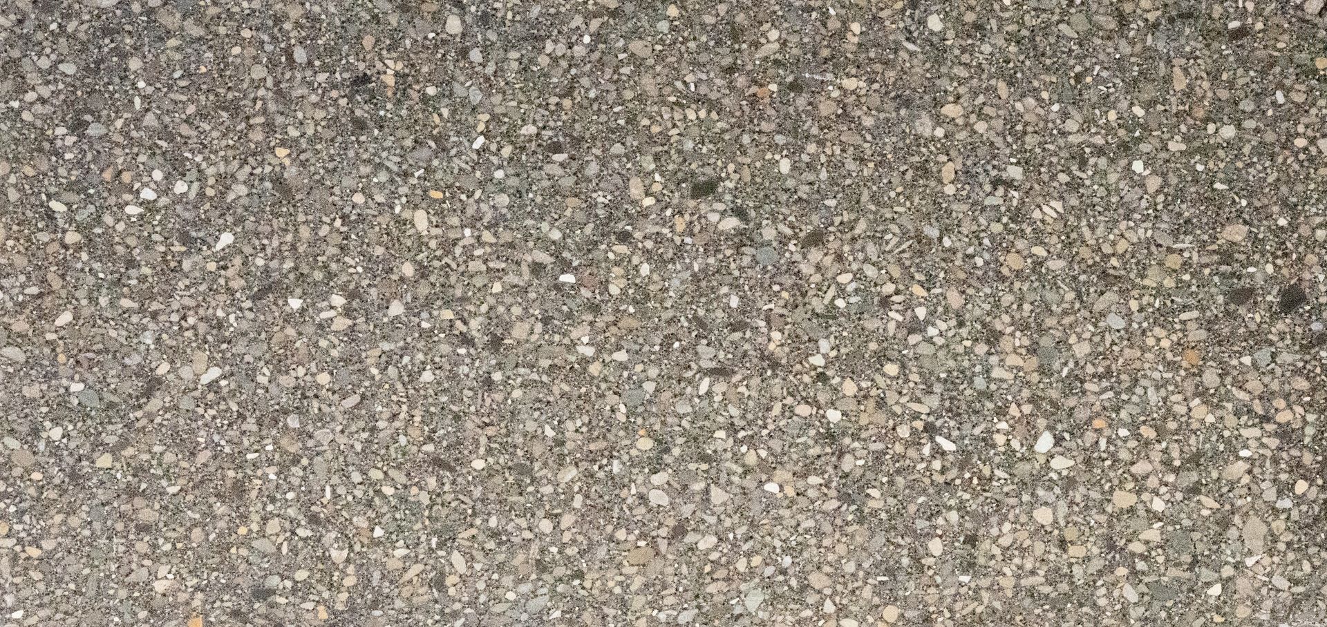Close-up of coarse gray-brown gravel texture