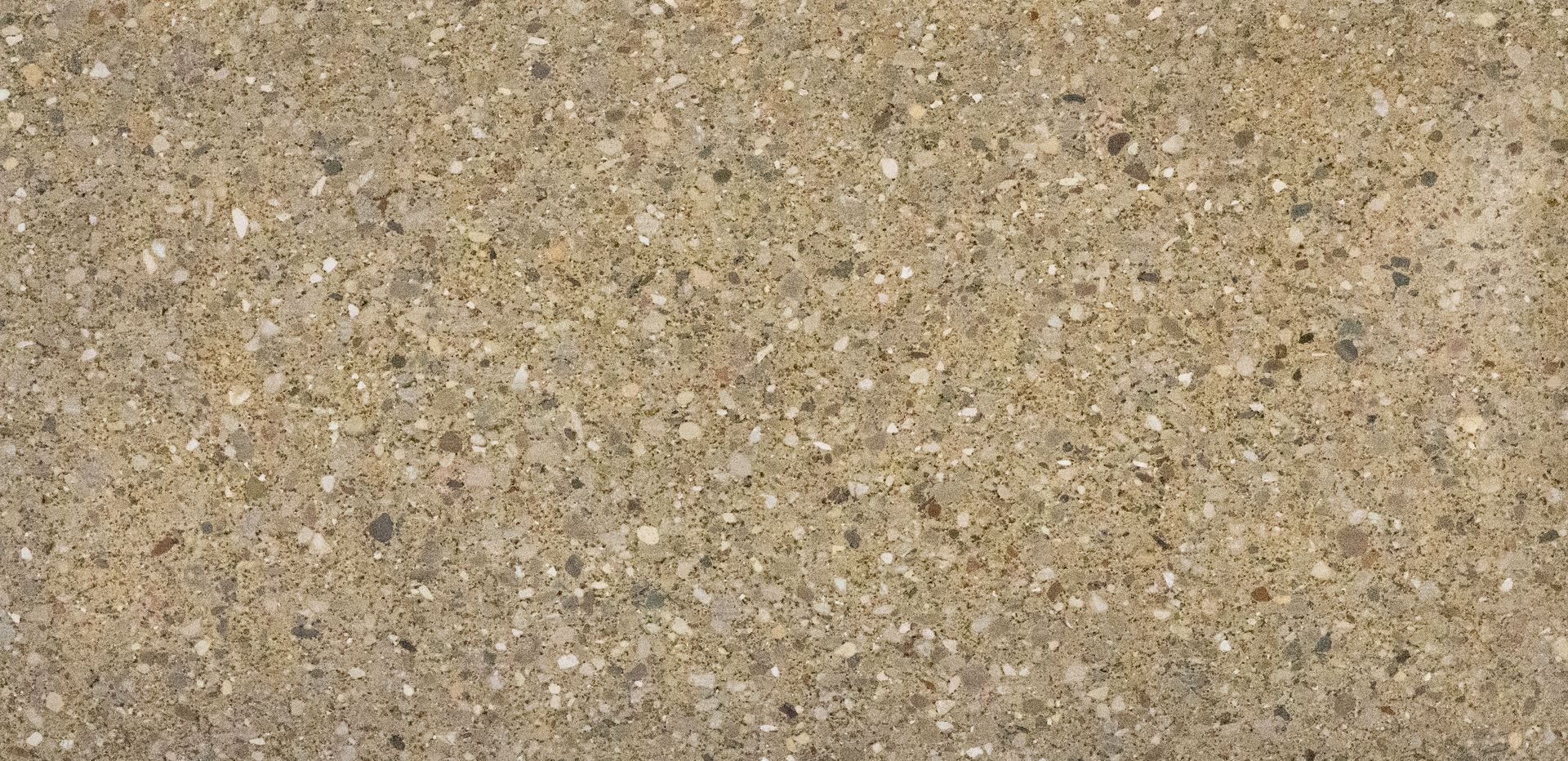 Close-up of tan, speckled gravel or sand texture
