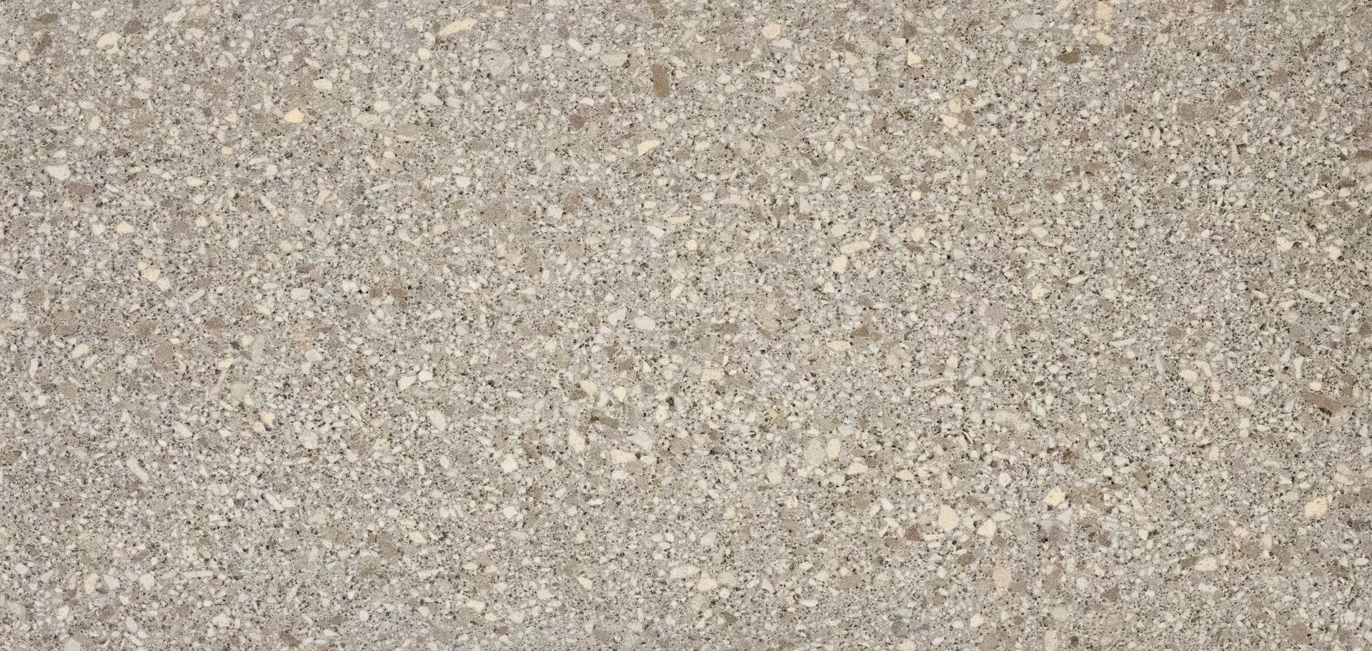 Close-up of a speckled beige and gray textured surface