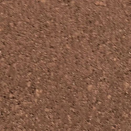 Brown granular surface, possibly soil or rock.