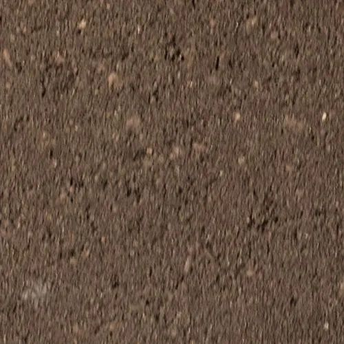 Brown, textured surface with small, speckled particles.