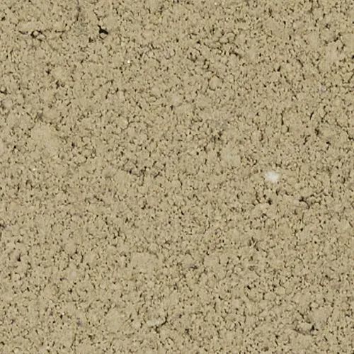 Close-up view of a rough, tan-colored concrete block surface.