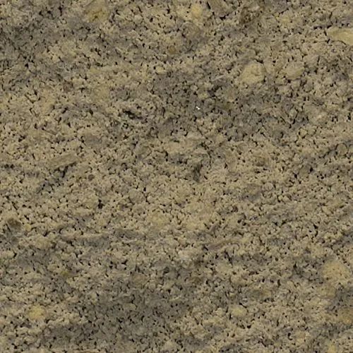Close-up of a mottled, rough-textured stone surface with varying shades of beige and gray.