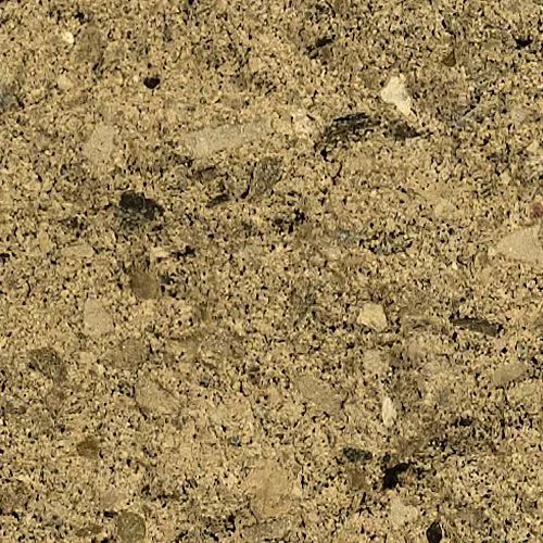 Close-up of rough, tan concrete surface with various-sized stones embedded within.