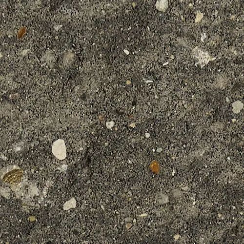 Close-up of gray concrete with embedded pebbles and small stones of various colors.