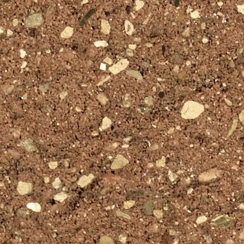 Close-up of red-brown aggregate concrete with visible small rocks of various colors and shapes.
