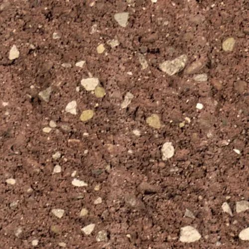 Close-up of reddish-brown soil with scattered small rocks of various colors.