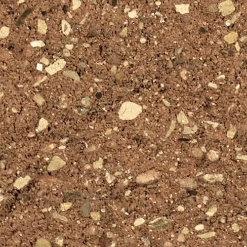 Close-up of reddish-brown concrete surface with scattered light-colored aggregate.