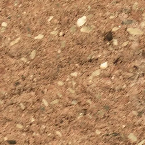 Red-brown stone surface, speckled with small, lighter-colored pebbles.