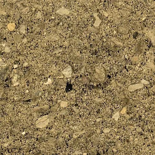 Close-up of a concrete surface with various-sized stones and a mottled tan and gray color.