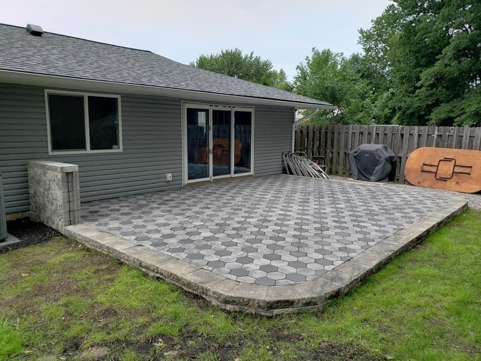 A house with a lush green lawn in front of it