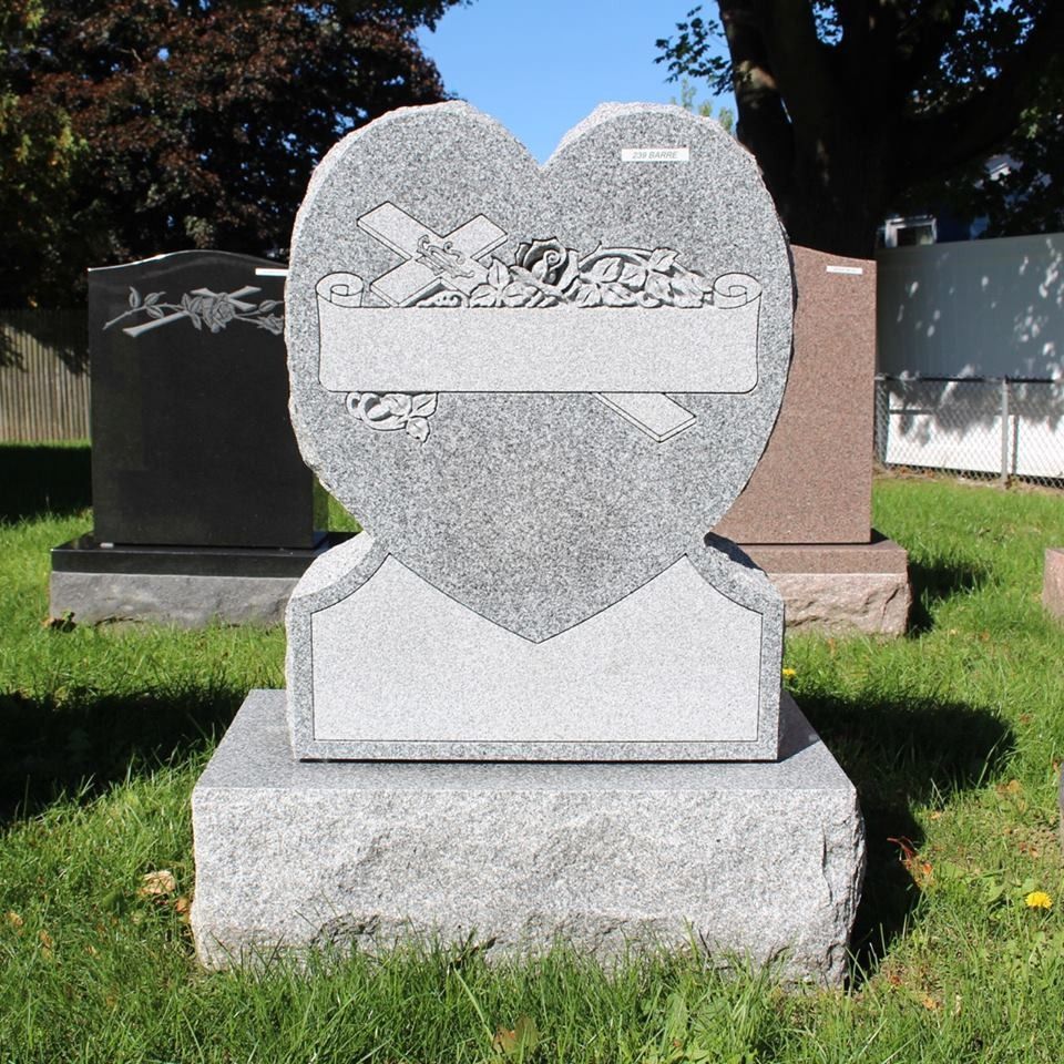 A heart-shaped gravestone in a cemetery