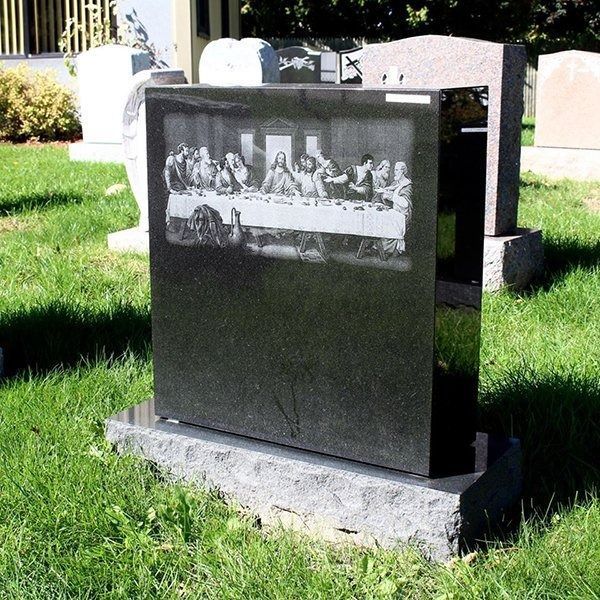 A grave with a picture of the last supper on it