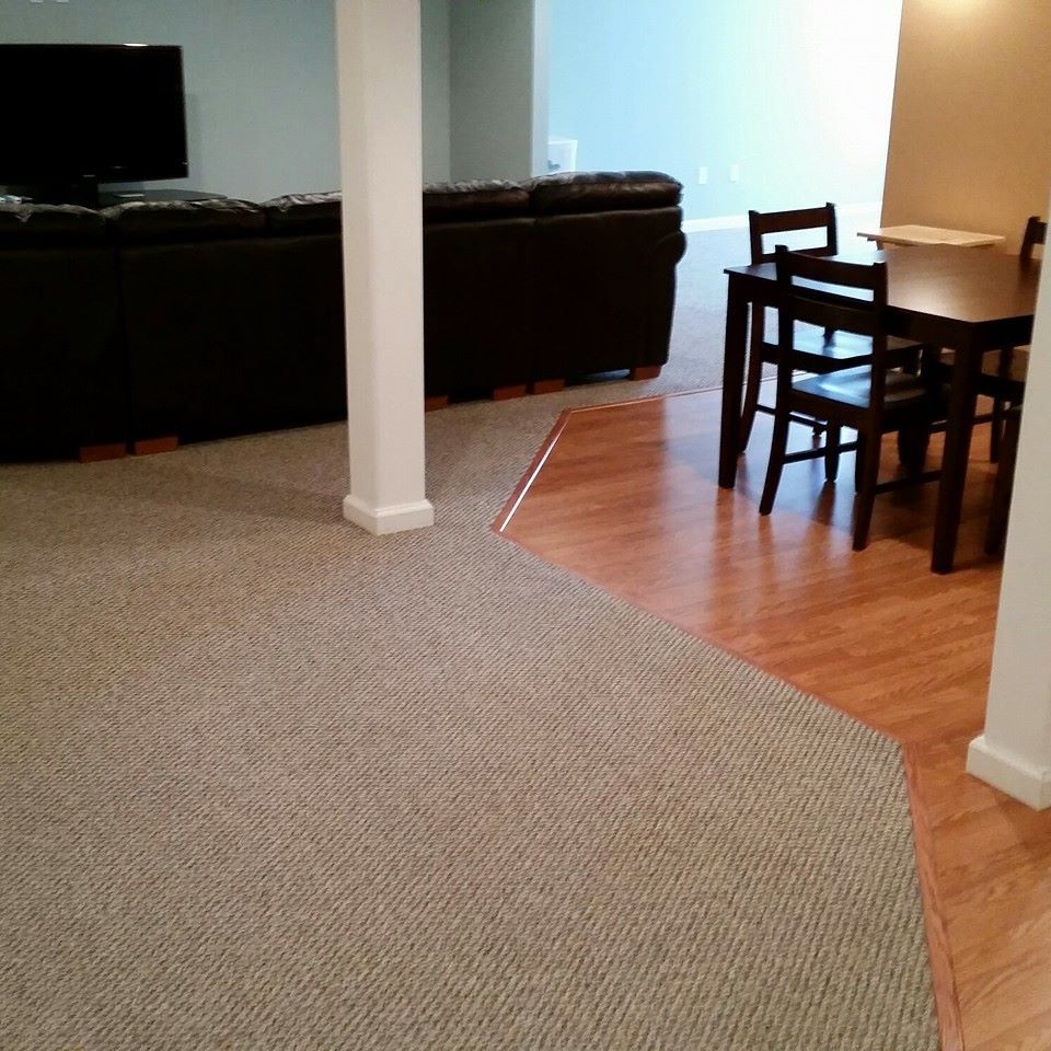 A living room with a table and chairs and a couch