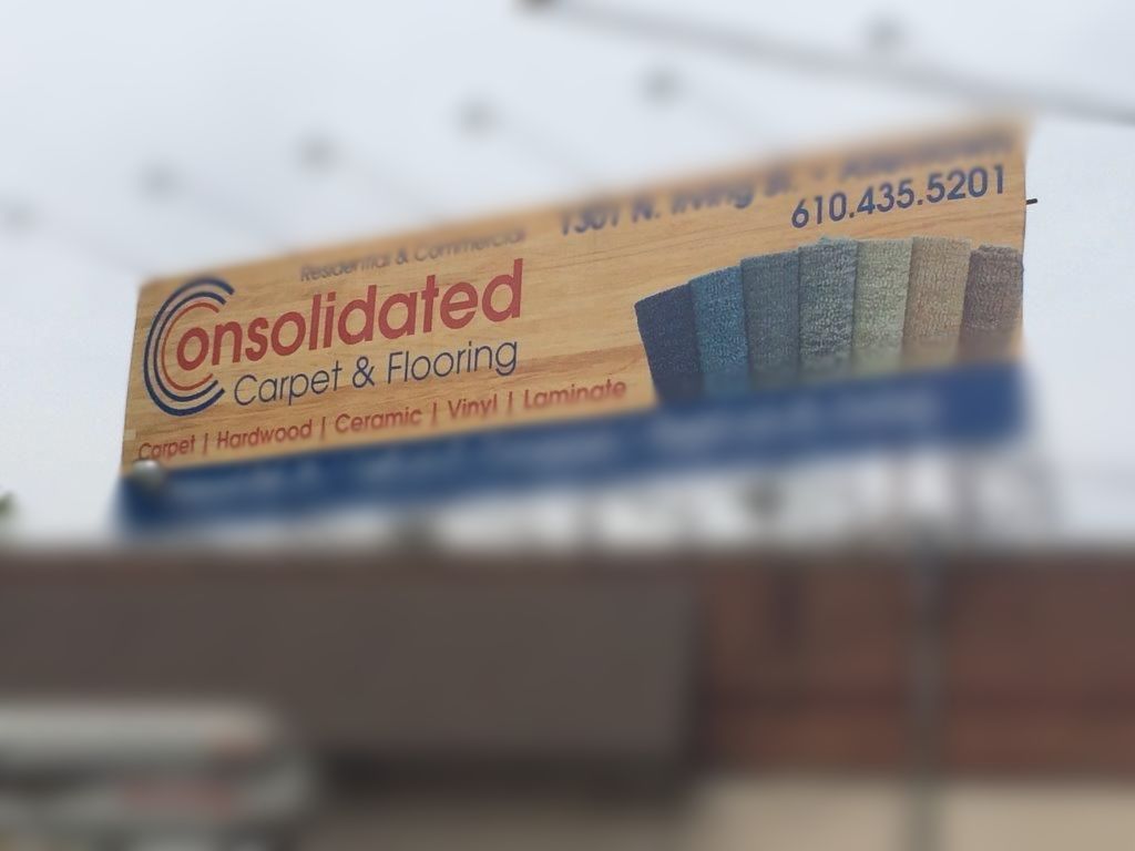 A large billboard for consolidated carpet and lacing