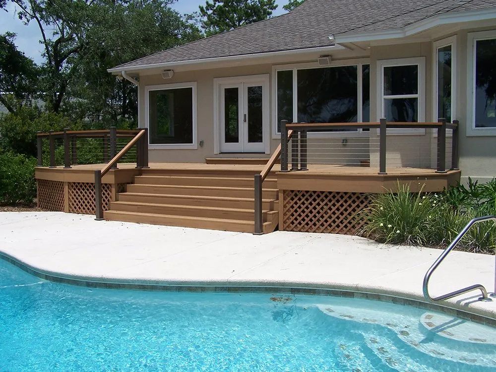 a house with a swimming pool in front of it