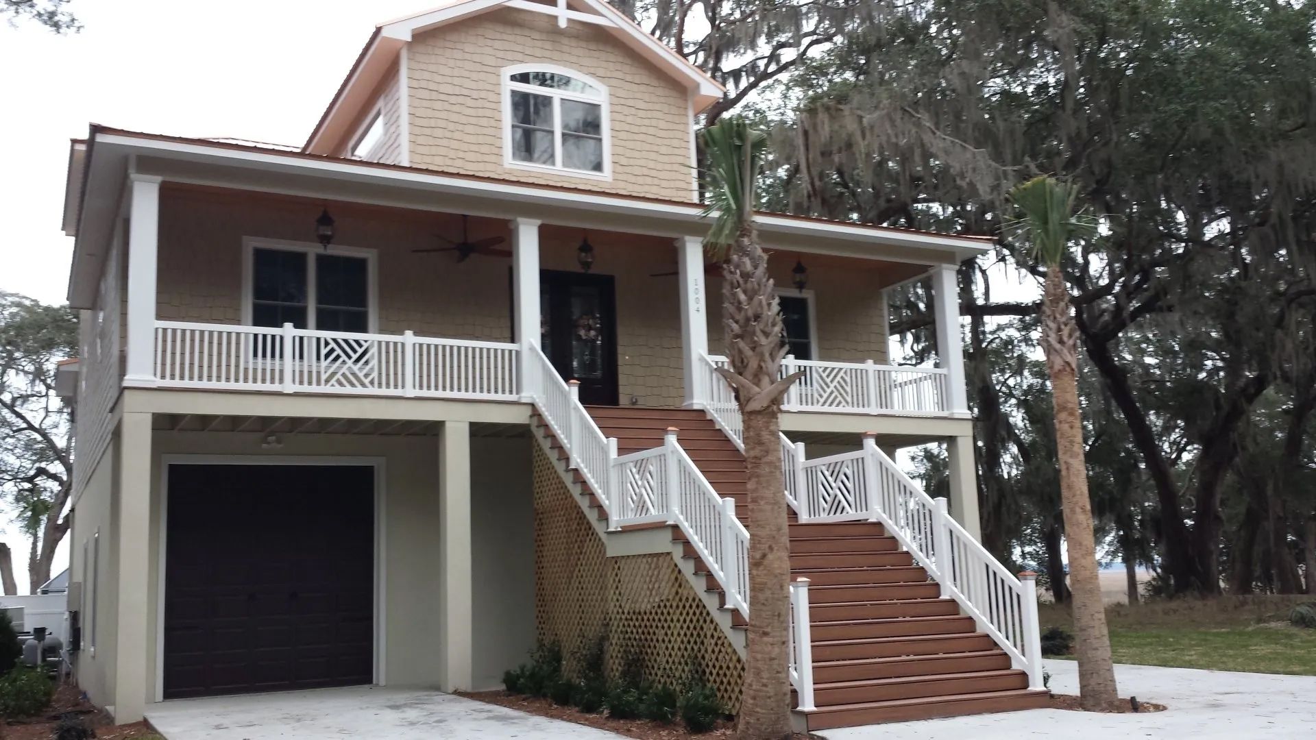 a large house with stairs leading up to it